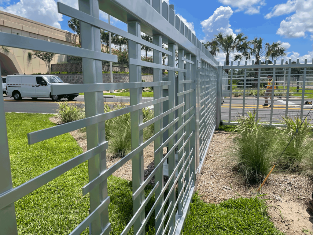 Detailed image of the ornamental fence near the SunTrax gates, highlighting its durable and aesthetic design.